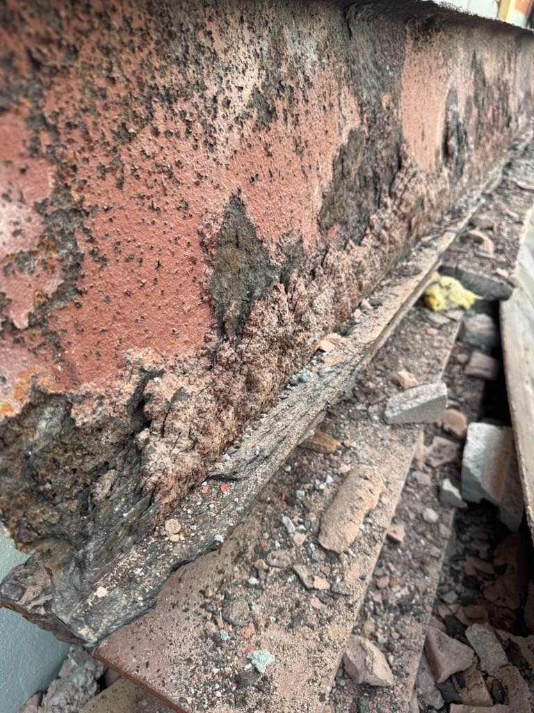 Close-up of deteriorated brick and mortar before restoration