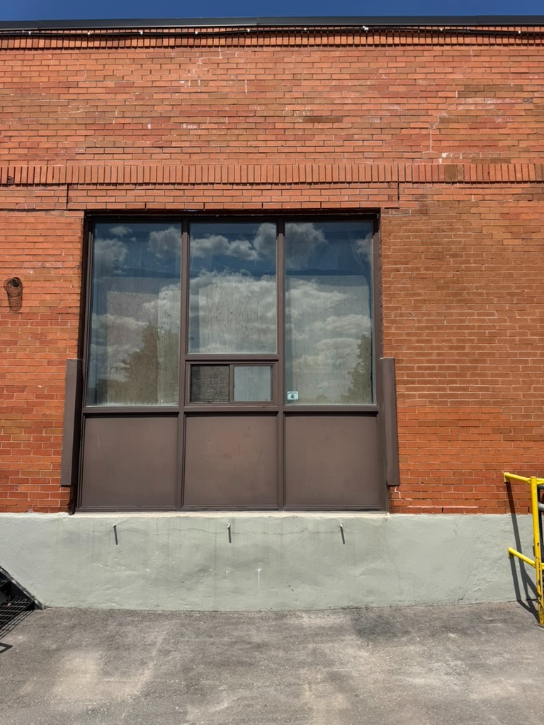 Completed commercial brick facade restoration with fresh parging